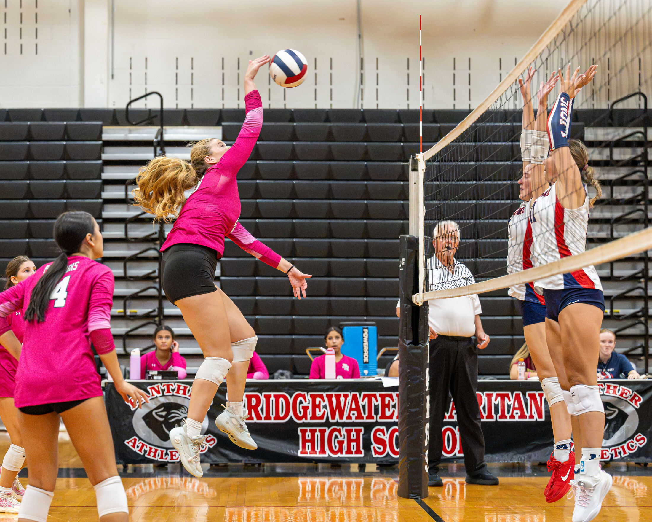 BRHS Panther girls volleyball hitter attacking at the net, Bridgewater NJ